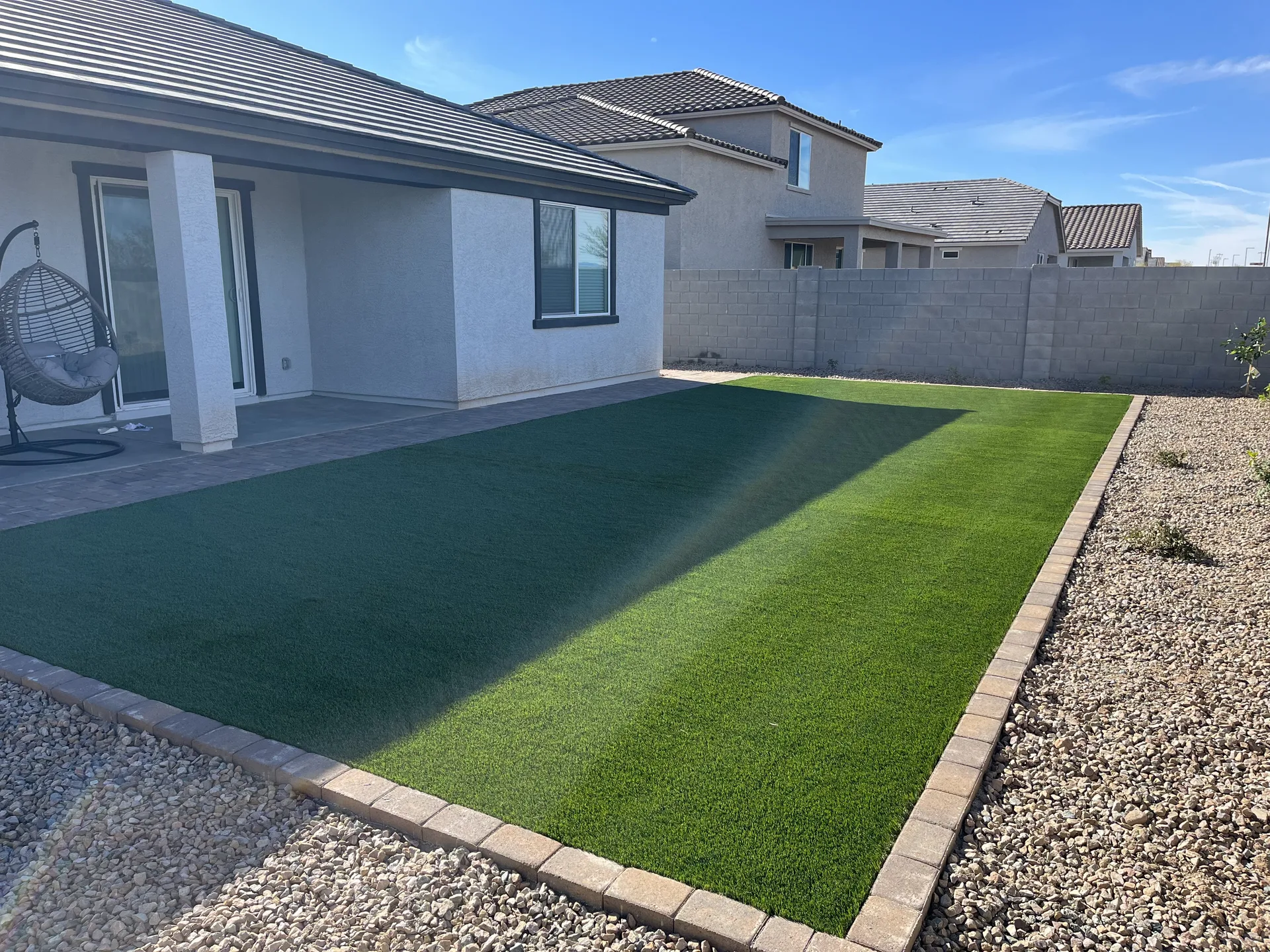 Backyard turf with hanging chair